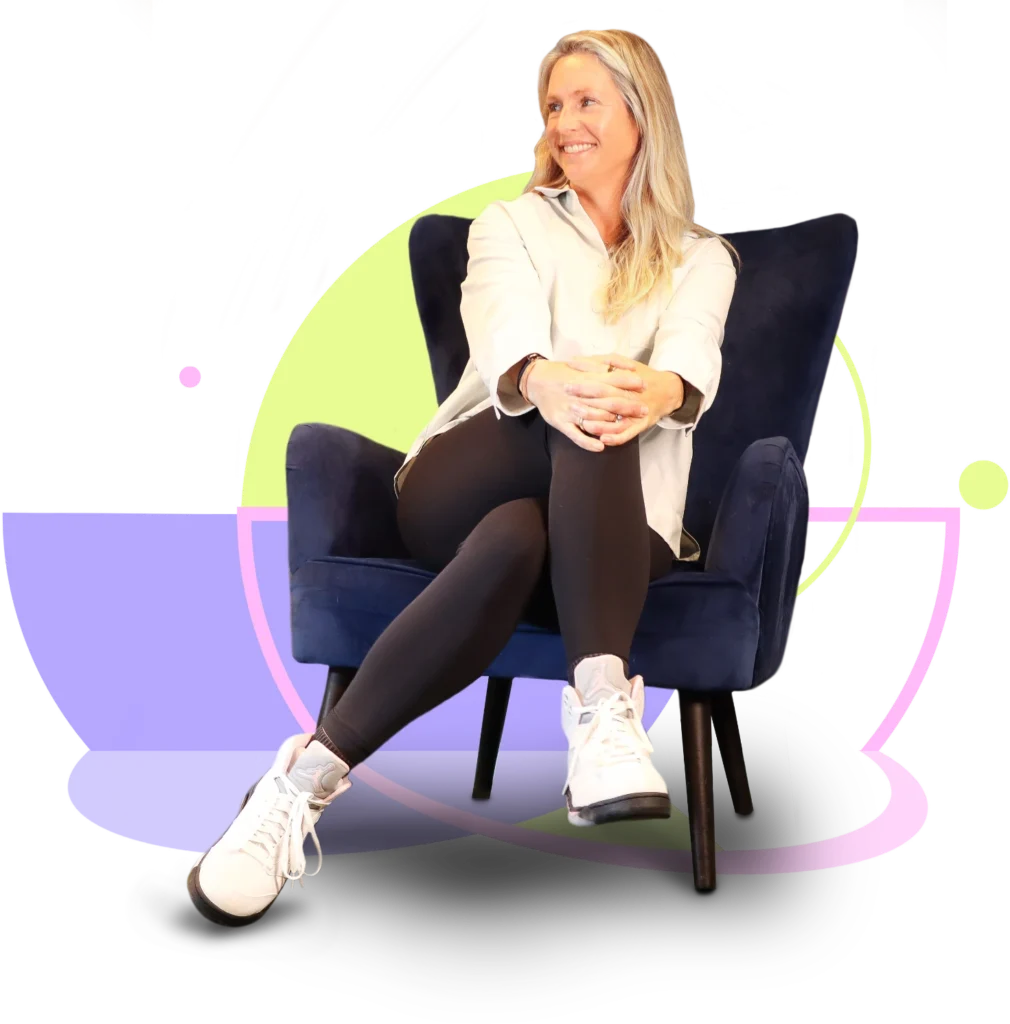 Julia Wuttke Feel Better Golf Coach & Health Coach, sitting on dark chair